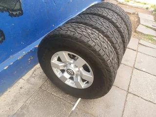 A clean set of 16inches original Nissan hardbody NP300 mags 6x139.7 PCD with Bridgestone tyres