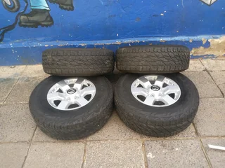A clean set of 16inches original Nissan hardbody NP300 mags 6x139.7 PCD with Bridgestone tyres