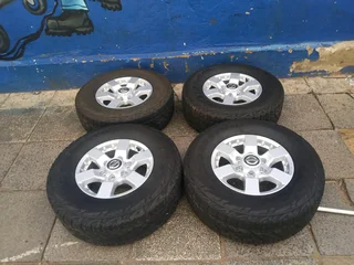 A clean set of 16inches original Nissan hardbody NP300 mags 6x139.7 PCD with Bridgestone tyres