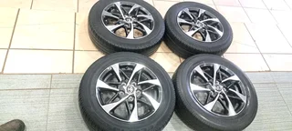 A set of 15inches original Toyota Rumion mags 5x114.3 PCD with tyres
