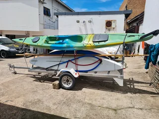 2x kayaks 1 small boat 1 wind surfer with licensed trailer