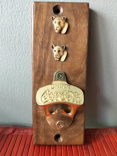 Vintage Coca-Cola bottle opener wall plaque