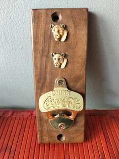 Vintage Coca-Cola bottle opener wall plaque