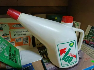 vintage BP Super TOU Tractor Oil Universal plastic container.