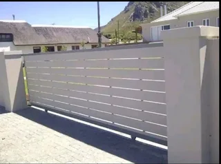 We do nutec gates. Pedestrian gate. Wall extension with nutec cladding .gate motor installation