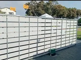 We do nutec gates. Pedestrian gate. Wall extension with nutec cladding .gate motor installation