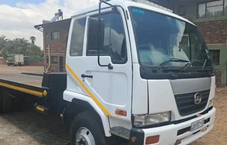 NISSAN UD TAGAXLE ROLLBACK