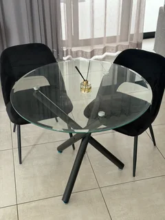 Glass dining table with two chairs