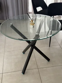 Glass dining table with two chairs