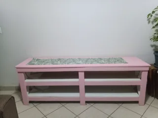 Pink wood TV stand