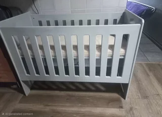 Grey wooden cot adjustable