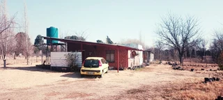 SMALL HOLDING .TWO FLATLETS.STRONG WATER. TWO BOREHOLES.SAVE AREA.CAN BUILD EASY 6 HOUSES.