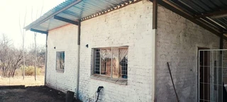 SMALL HOLDING .TWO FLATLETS.STRONG WATER. TWO BOREHOLES.SAVE AREA.CAN BUILD EASY 6 HOUSES.