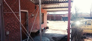 SMALL HOLDING .TWO FLATLETS.STRONG WATER. TWO BOREHOLES.SAVE AREA.CAN BUILD EASY 6 HOUSES.