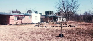 SMALL HOLDING .TWO FLATLETS.STRONG WATER. TWO BOREHOLES.SAVE AREA.CAN BUILD EASY 6 HOUSES.