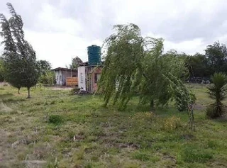 SMALL HOLDING .TWO FLATLETS.STRONG WATER. TWO BOREHOLES.SAVE AREA.CAN BUILD EASY 6 HOUSES.