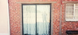 SMALL HOLDING .TWO FLATLETS.STRONG WATER. TWO BOREHOLES.SAVE AREA.CAN BUILD EASY 6 HOUSES.