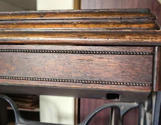 Antique Singer treadle sewing machine cabinet — dating from the early 1900s to 1940s