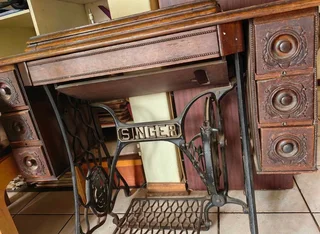 Antique Singer treadle sewing machine cabinet — dating from the early 1900s to 1940s