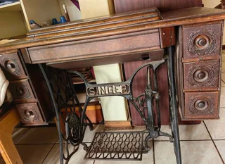 Antique Singer treadle sewing machine cabinet — dating from the early 1900s to 1940s