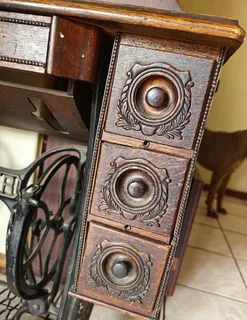 Antique Singer treadle sewing machine cabinet — dating from the early 1900s to 1940s