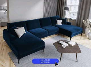 U-shaped couch in blue velvet and white