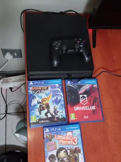 PlayStation 4 (PS4) Slim console with a DualShock 4 controller and three games