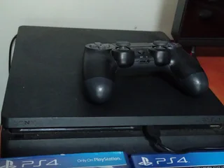 PlayStation 4 (PS4) Slim console with a DualShock 4 controller and three games