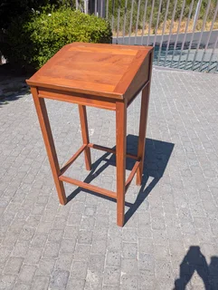 Wooden standing desk with storage