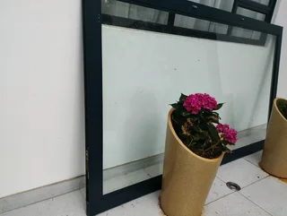 Aluminium framed glass door (negotiable) that comes with handles and keys with dimensions:1,465m wid