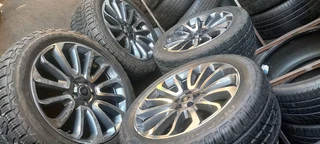 A set of 22" range rover sport and defender mags and cooper discovery tyres
