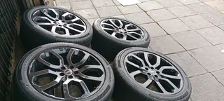 A set of 22" Range Rover sport mags and continental tyres