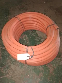 An orange industrial long life 30m long hose pipe size 15mm