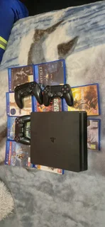 Playstation 4 slim with 10 games and 3 controllers