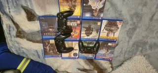 Playstation 4 slim with 10 games and 3 controllers