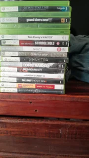 Xbox 360 with 18 game discs included and 2 download games included