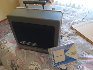 Bell and Howell 16 mm projector in original packaging.