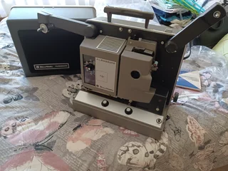Bell and Howell 16 mm projector in original packaging.