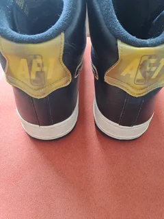 Black and gold high top airforce ones