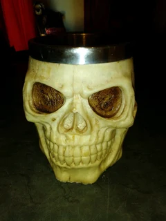 Resin made skull mug stainless steel inside in box new.