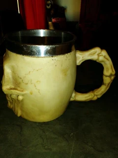 Resin made skull mug stainless steel inside in box new.