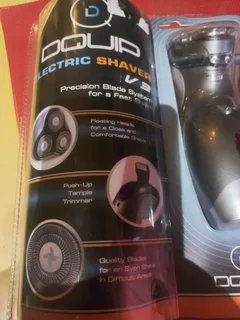 Electrical shaver brand new sealed in plastic holder.