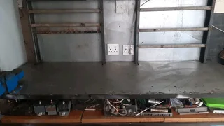 Stainless steel work bench 2metres plus extra 5cm on wheels.