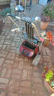Golf clubs and golf on push cart