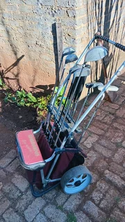 Golf clubs and golf on push cart