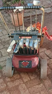 Golf clubs and golf on push cart