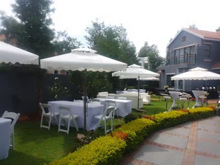 White VIP lounge couches, ottomans and Cocktails mix. Indoor or Outdoor decor set up. Full decor.