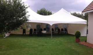 Colourful Lounge Couches, Ottomans and Cocktails decor set up. Stretch tent hire and green carpet