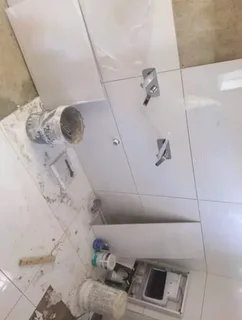 WE SPECIALIZE IN BATHROOMS RENOVATIONS TILERS PLUMBERS PAINTERS CARPENTER HANDYMAN WATERPROOFING