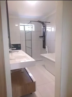 WE SPECIALIZE IN BATHROOMS RENOVATIONS TILERS PLUMBERS PAINTERS CARPENTER HANDYMAN WATERPROOFING